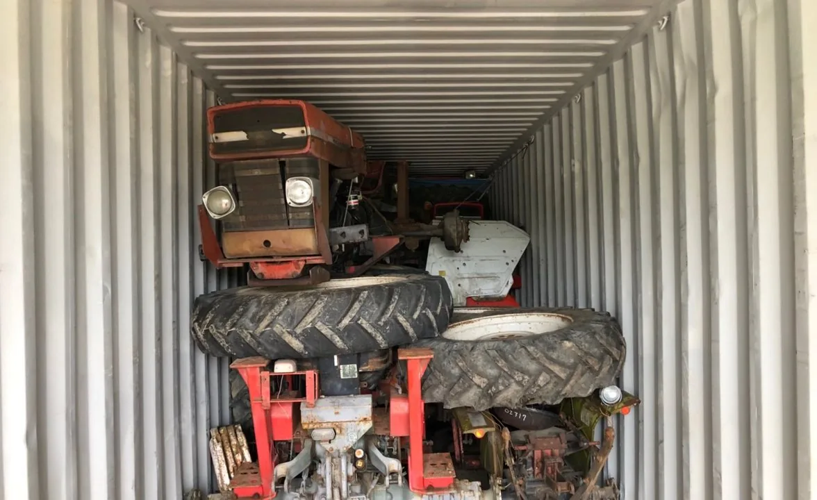Loading a tractor into an export container
